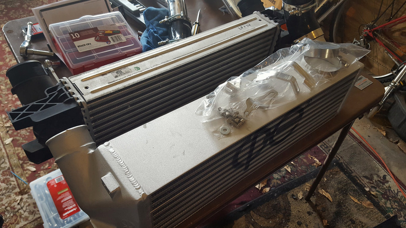 New Intercooler in front of the old one. It’s obviously thicker with aluminum end tanks.